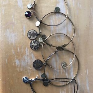 Five Alex and Ani bracelets